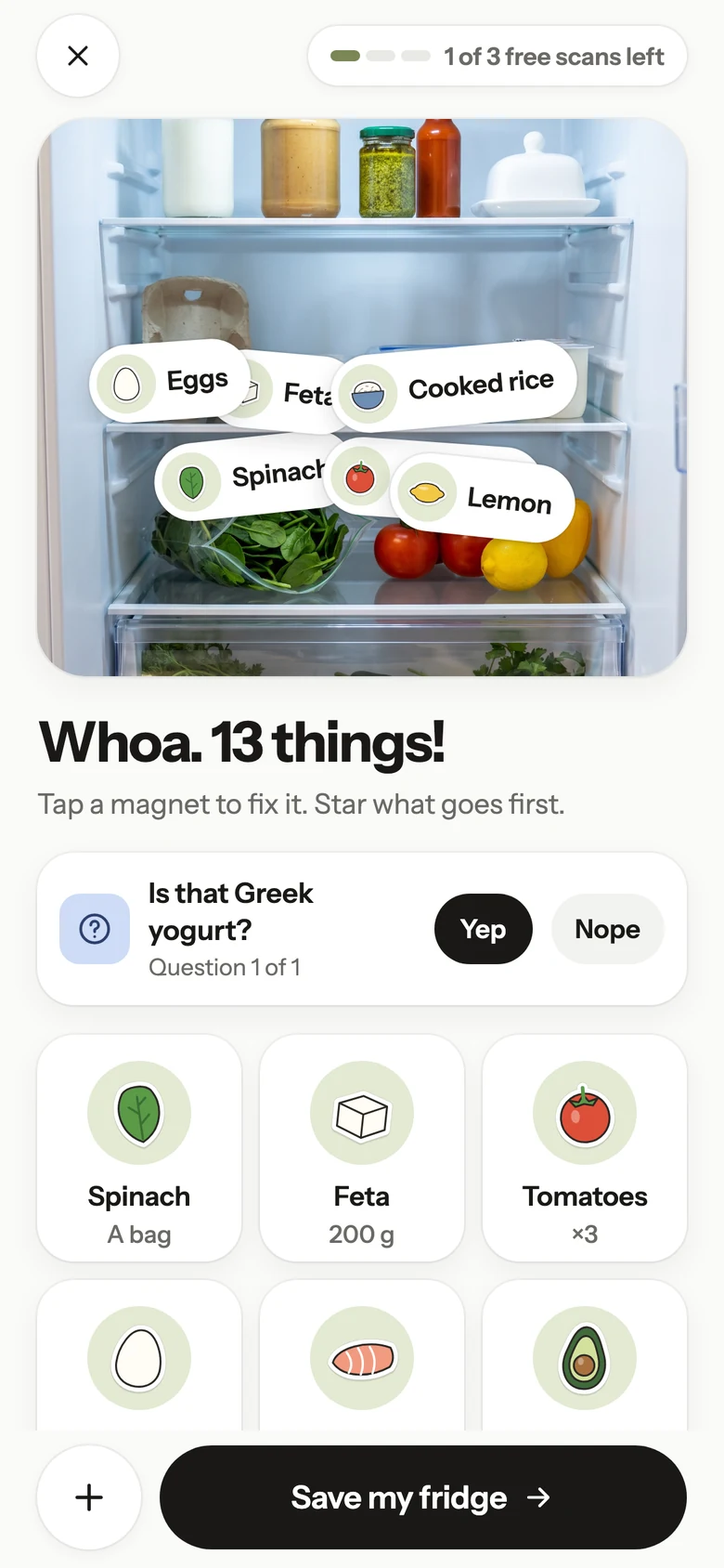 Frigomi after a fridge scan: “Whoa. 13 things!”, with the eggs, feta, cooked rice, spinach, tomatoes and lemon it found pinned on the photo as magnets.
